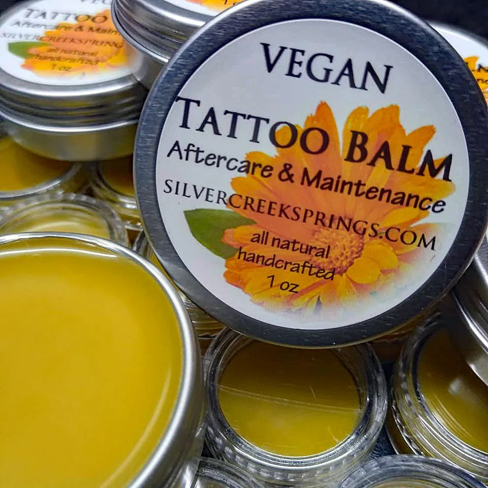 An open tin of vegan Tattoo Balm