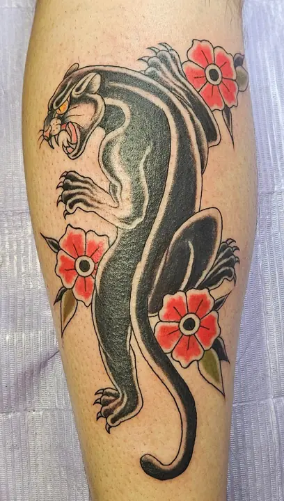 Traditional panther with flowers — tattoo by Keira Geneva