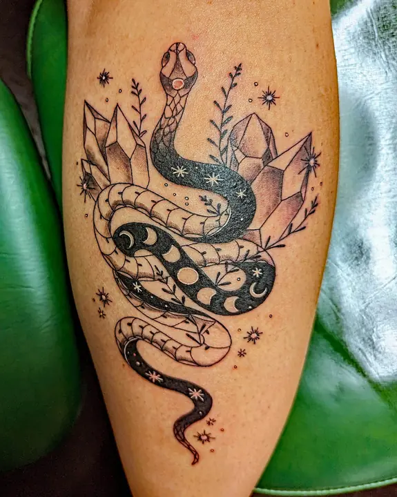 Snake with moon phases and crystals — tattoo by Maraya Anderson