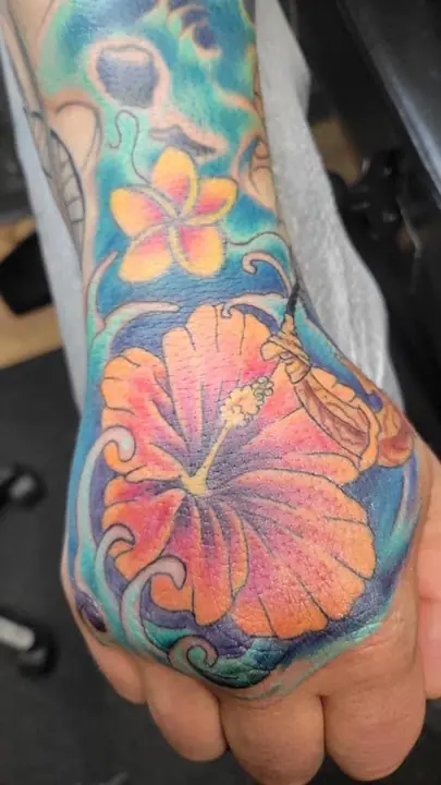 Hibiscus hand tattoo by Michelle Nordeen